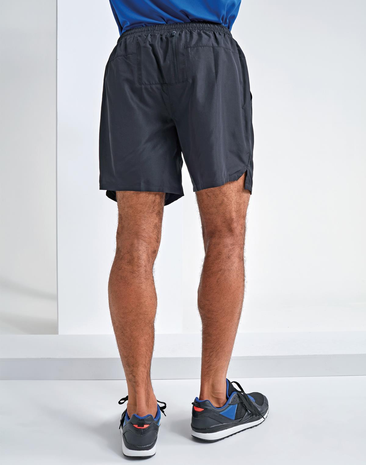 Rival's ultimate running shorts in action, worn by a runner in full stride. The shorts feature a sleek design with the Rival logo subtly embroidered on the side. Made from lightweight, moisture-wicking fabric, they offer maximum breathability and comfort during intense workouts. The adjustable waistband ensures a secure fit, while the built-in briefs provide added support and coverage. These performance-driven shorts are the perfect companion for any runner seeking comfort and style on their journey