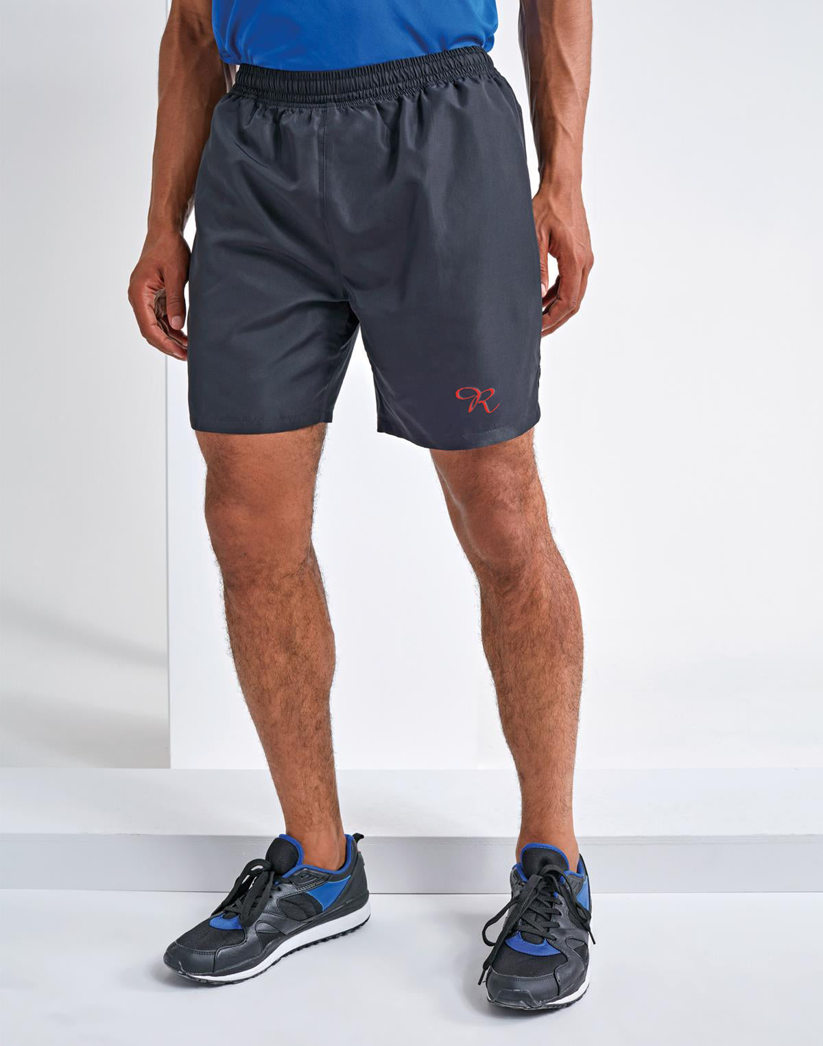 Rival's ultimate running shorts in action, worn by a runner in full stride. The shorts feature a sleek design with the Rival logo subtly embroidered on the side. Made from lightweight, moisture-wicking fabric, they offer maximum breathability and comfort during intense workouts. The adjustable waistband ensures a secure fit, while the built-in briefs provide added support and coverage. These performance-driven shorts are the perfect companion for any runner seeking comfort and style on their journey